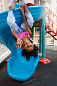 full-shot-smiley-girl-slide_23-2149739072